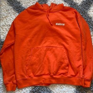 James Charles sisters merch hoodie orange